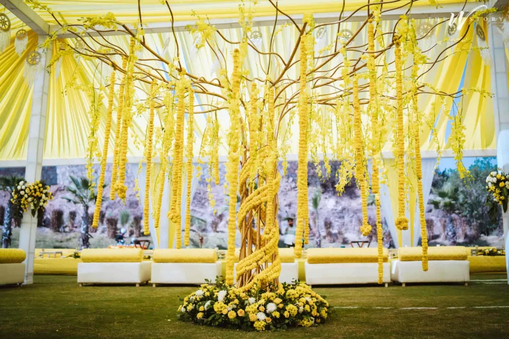 Vibrant yellow floral wedding decor setup
